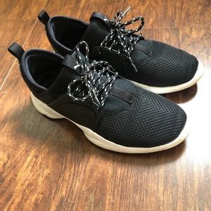 Black puma athletic  shoes.